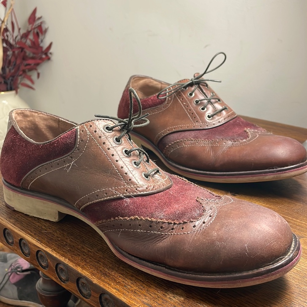 Men’s Johnston & Murphy size 12 (U.S.) burgundy suede and brown leather shoes.